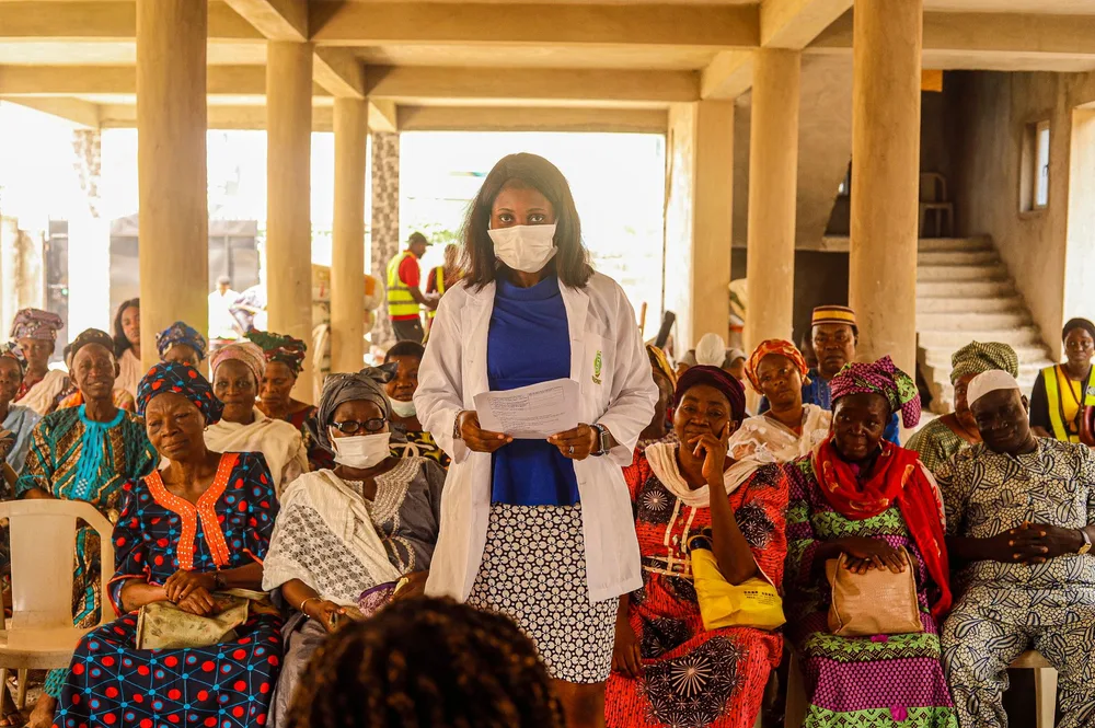 Health professional reviewing an education project with colleagues